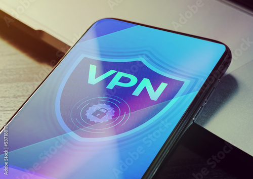 VPN - Virtual private network application for encrypt connection, anonymous internet using and unblock websites. Close up vpn security network sign logo on the smartphone screen  photo