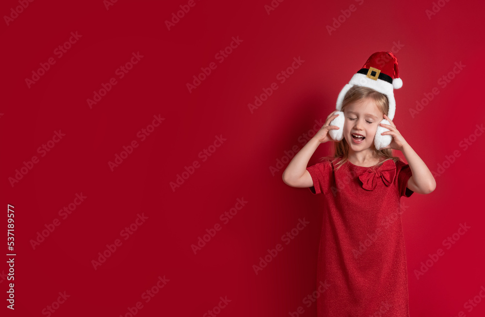 Long banner. girl in christmas clothes, surprise and laugh on a red background