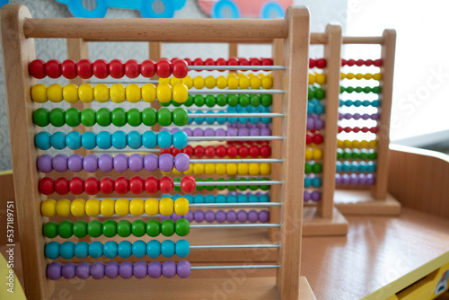 School abacus with colorful beads, closeup view, copy space. Kids learning, kids math class concept