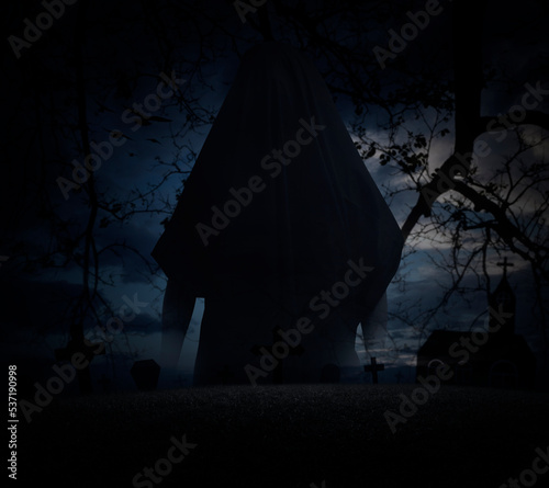 Grim reaper standing over grass, dead tree, cross, birds, church with spooky cloudy sky, Halloween mystery concept