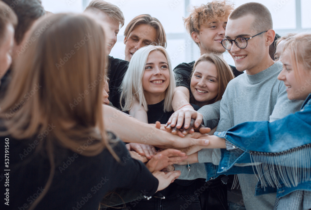 Fototapeta premium large group of young people showing their unity