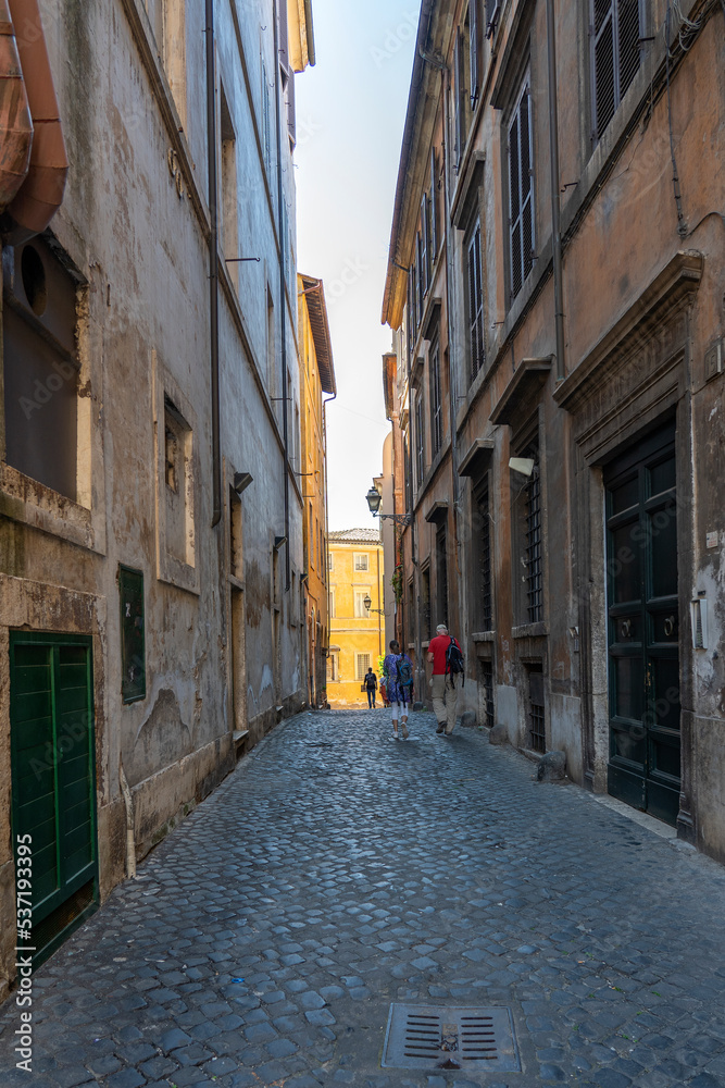 One of the many narrow streets (Via della Tribuna di Campitelli) in Rome, Italy