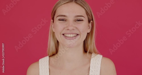 Happy joyful young woman laughing out loud after hearing ridiculous anecdote