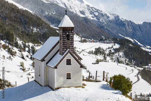 Church in a alp's valley in beautiful winter landscape
