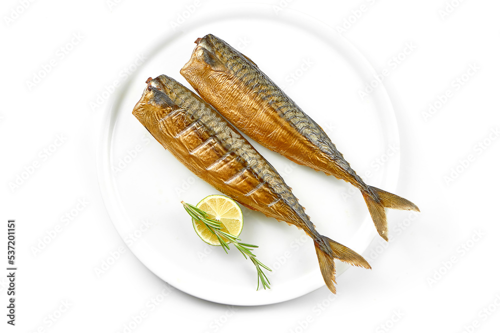 Smoked mackerel in a white plate on a white background. Close-up, selective focus. Smoked mackerel in a white plate on a white background. Close-up, selective focus.