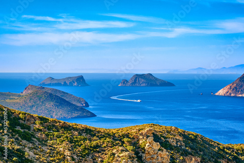 Beautiful landscape, islets in bay, ferry boat enter, sunny summer day