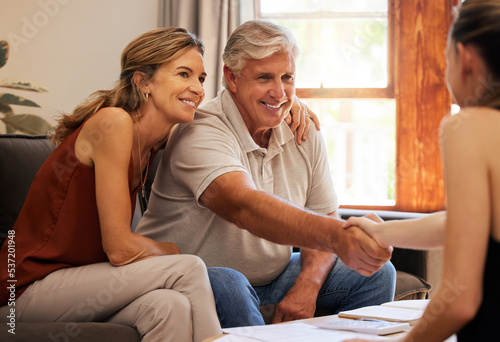 Real estate, family home and senior couple doing handshake with agent to sell house. Old man and woman moving out for retirement with documents, paperwork and contract, shaking hands with realtor
