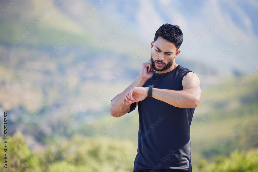 Man on run check pulse, heart rate and body stats for health with smartwatch on nature run. Runner does outdoor exercise for fitness, sports workout and cardio training to increase race running time Man on run check pulse, heart rate and body stats for health with smartwatch on nature run. Runner does outdoor exercise for fitness, sports workout and cardio training to increase race running time