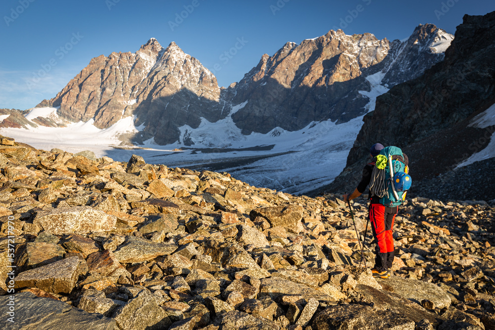 Alpinist looking at mountains ridge view