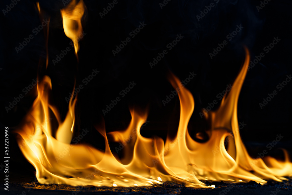 fire and molten plastic on a black background. the concept of fire in the kitchen and malfunctions, breakdowns of electrical appliances and wiring, installation of fire safety systems. fire and molten plastic on a black background. the concept of fire in the kitchen and malfunctions, breakdowns of electrical appliances and wiring, installation of fire safety systems.