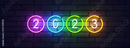 2023 New Year neon background colorful. Merry Christmas neon sign. Logo, emblem, banner and label, bright signboard, light banner
