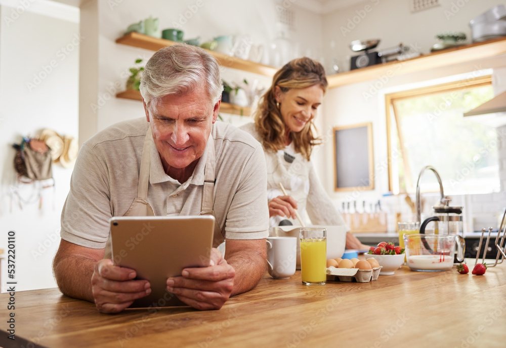 Cooking, tablet and food with old couple in kitchen in the morning for breakfast, health and internet recipe together. Happy, digital and retirement with senior man and woman baking for diet at home Cooking, tablet and food with old couple in kitchen in the morning for breakfast, health and internet recipe together. Happy, digital and retirement with senior man and woman baking for diet at home