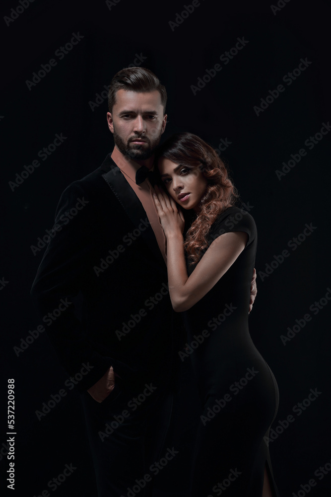 portrait of fashion couple on black background portrait of fashion couple on black background
