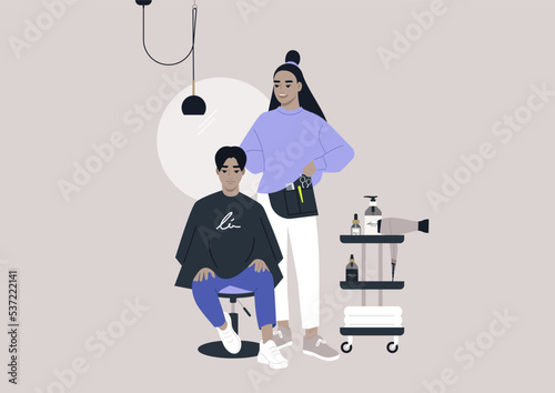 Hair salon, a client sitting in the chair covered with a cape, a master standing next to them with a belt bag