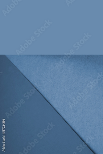 Textured and plain blue purple sheet papers forming two triangles and vertical blank rectangle for creative cover designing