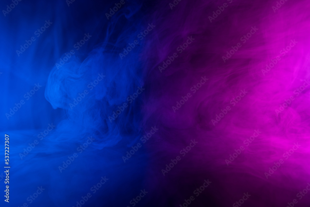 Abstract neon colored flowing smoke clouds background