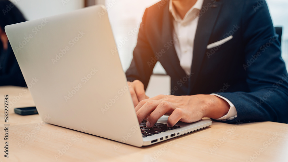 Closeup of businessman working at office, Man hands typing keyboard on laptop or computer. Closeup of businessman working at office, Man hands typing keyboard on laptop or computer.