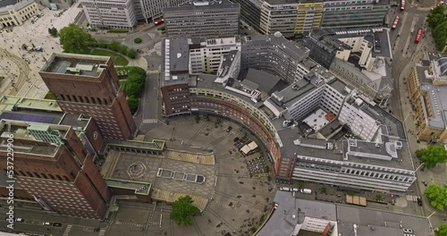 Oslo Norway v7 birds eye view drone fly around fridtjof nansen's place the circular square, tilt up capturing rådhuset city hall and fjord waterfront harbor view - Shot with Mavic 3 Cine - June 2022 photo