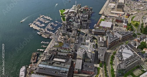 Oslo Norway v36 birds eye view drone fly around tjuvholmen and aker brygge neighborhoods capturing upscale waterfront eateries with inner oslofjord view in summer - Shot with Mavic 3 Cine - June 2022 photo
