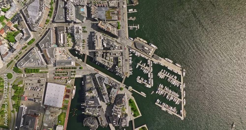Oslo Norway v37 cinematic vertical top down view drone flyover tjuvholmen peninsula sentrum neighborhood capturing waterfront city town hall and ferry wharf - Shot with Mavic 3 Cine - June 2022 photo