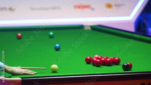 A professional snooker player in action as he plays a shot during the Hong Kong master tournament competition. photo