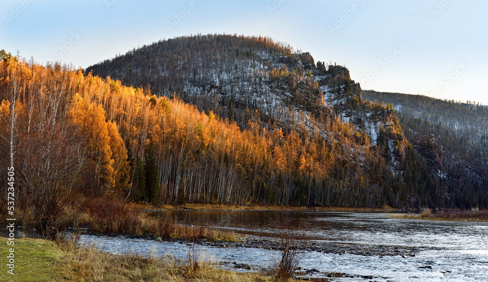 Autumn landscape. Mountain river in the taiga. Russia. Nature of Eastern Siberia. Autumn landscape. Mountain river in the taiga. Russia. Nature of Eastern Siberia.