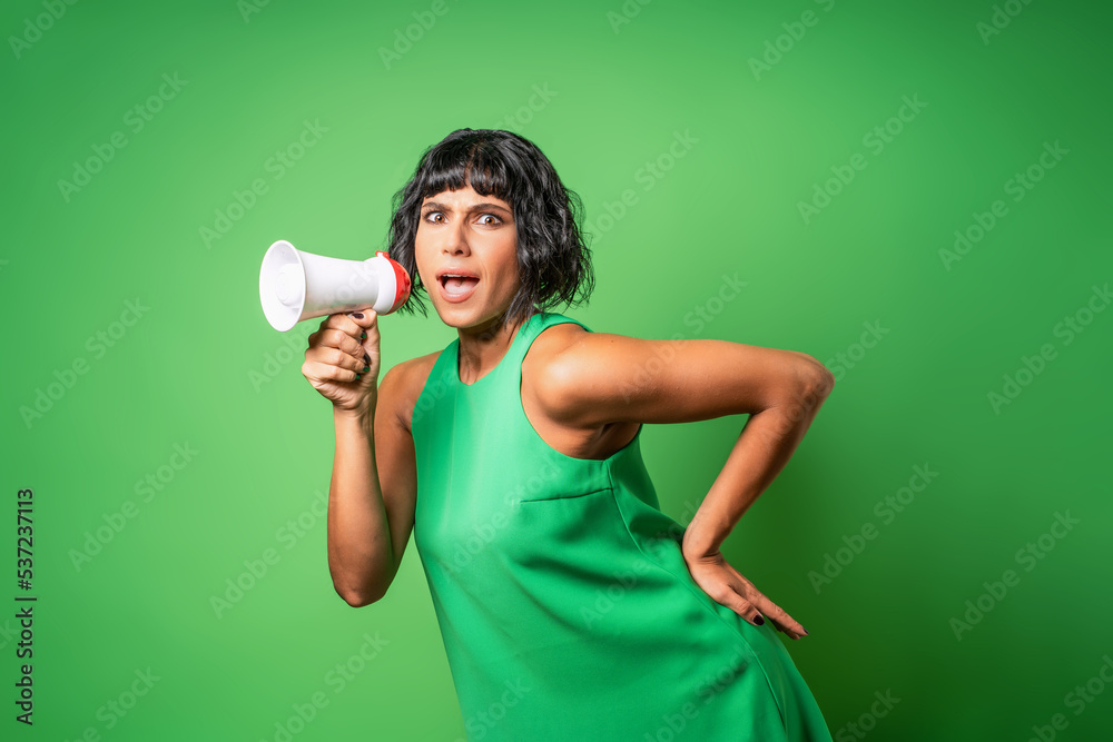 A young woman makes an announcement with a megaphone - cutout image on