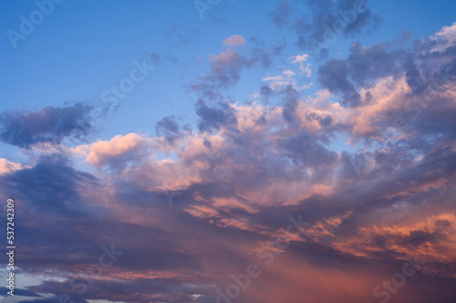The landscape of the sunset sky, clouds of various shapes and colors create a dramatic scene, natural abstraction