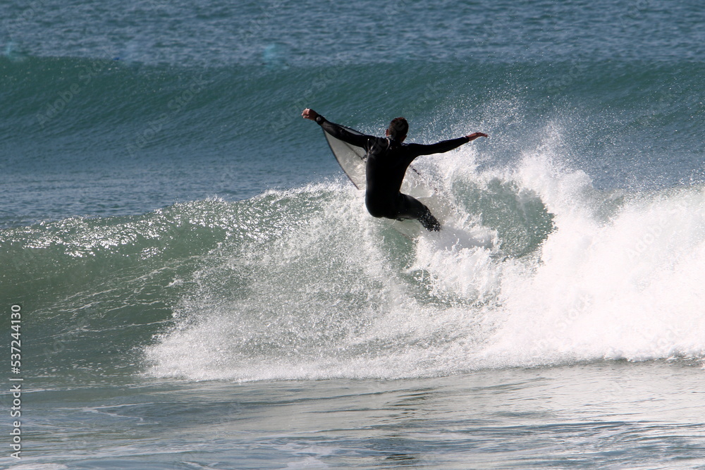 Surfing on high waves on the Mediterranean Sea in northern Israel. Surfing on high waves on the Mediterranean Sea in northern Israel.