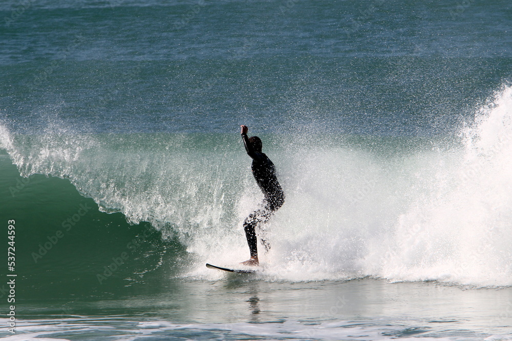 Surfing on high waves on the Mediterranean Sea in northern Israel. Surfing on high waves on the Mediterranean Sea in northern Israel.
