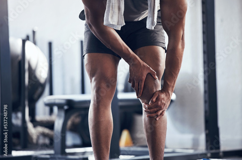 Knee, legs and joint pain of gym man, athlete and training, workout or exercise in fitness club. Bodybuilder bone fracture problem, muscle injury and accident, health risk and sports trauma emergency