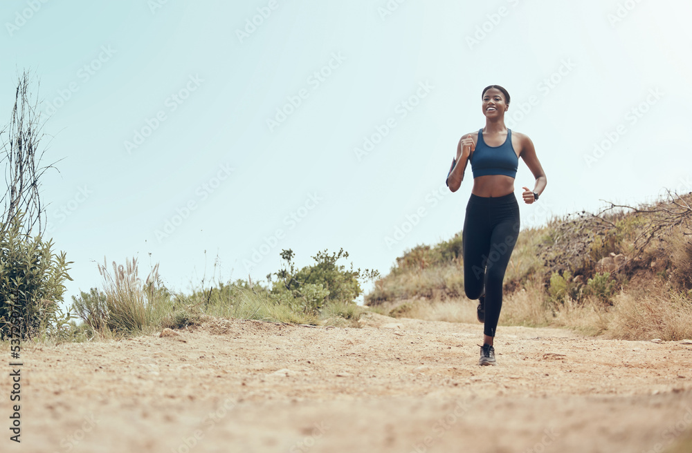 Fitness, running and black woman on nature trail for marathon cardio exercise in Hollywood USA. African American athlete enjoying outdoor run for training and cardiovascular health lifestyle.