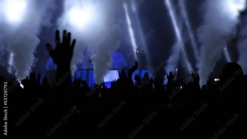 Silhouette hands of audience crowd people enjoying the concert, cheering clapping hands 