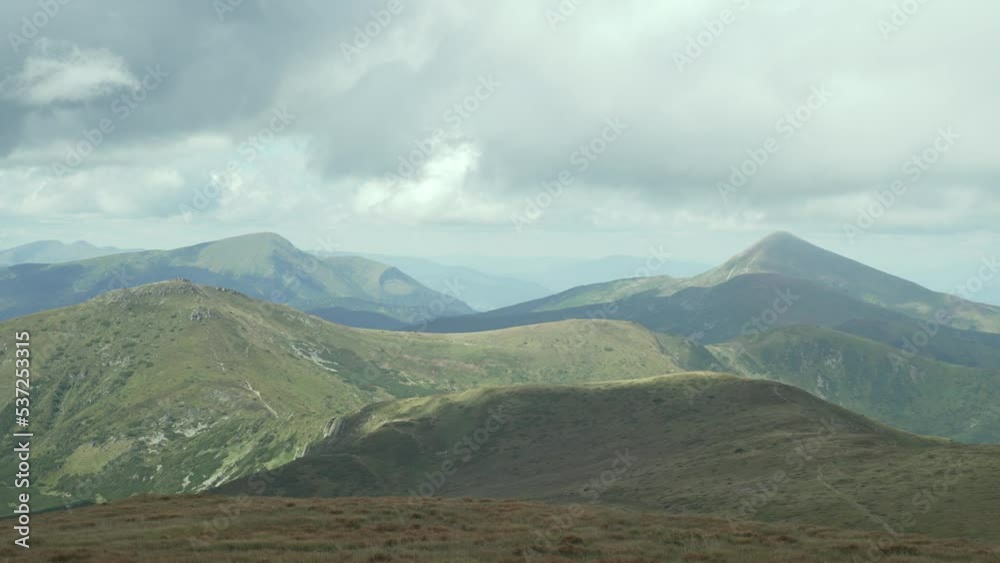Panorama of the mountains. Mountain landscape in summer. Carpathians, the top of Hoverla. Sunny weather with clouds in the mountains. High quality 4k footage Panorama of the mountains. Mountain landscape in summer. Carpathians, the top of Hoverla. Sunny weather with clouds in the mountains. High quality 4k footage
