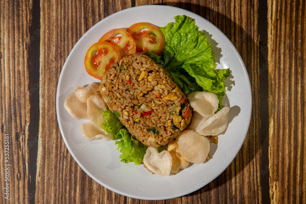A shaped fried rice with garnish A shaped fried rice with garnish