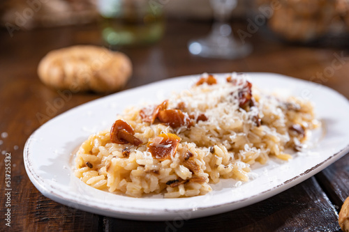 Risotto with porcini mushrooms.Typical Italian food white rice with mushrooms in parmesan sauce. Antipasto for dinner. Copy space