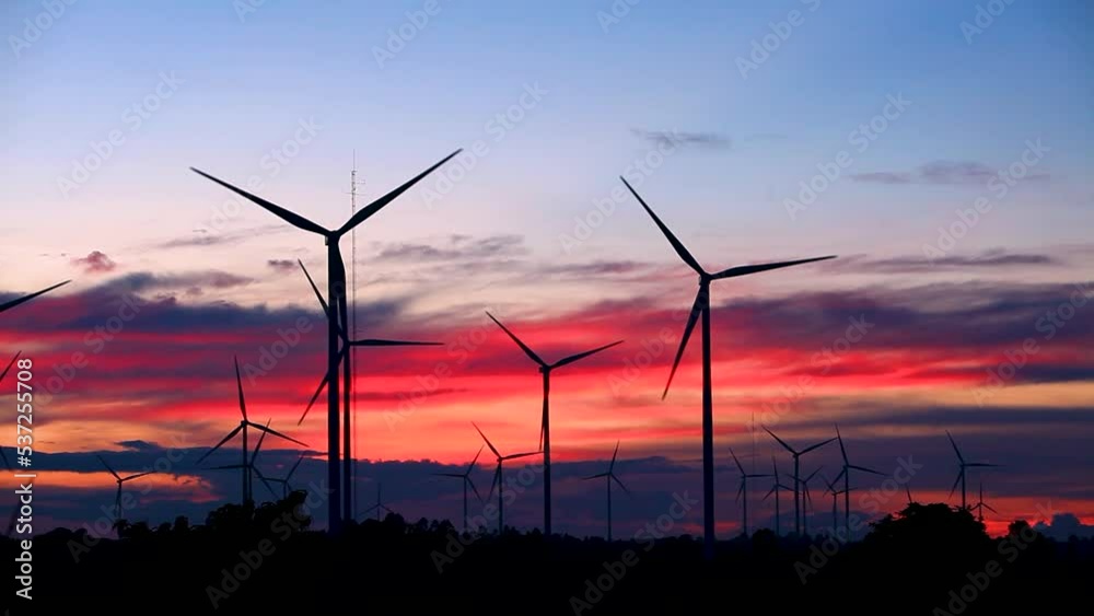 Wind turbine generator wind energy plant power turbine. Wind power renewable electric energy production. Wind energy nature clean fields blue sky alternative energy sunset clouds background. Wind turbine generator wind energy plant power turbine. Wind power renewable electric energy production. Wind energy nature clean fields blue sky alternative energy sunset clouds background.