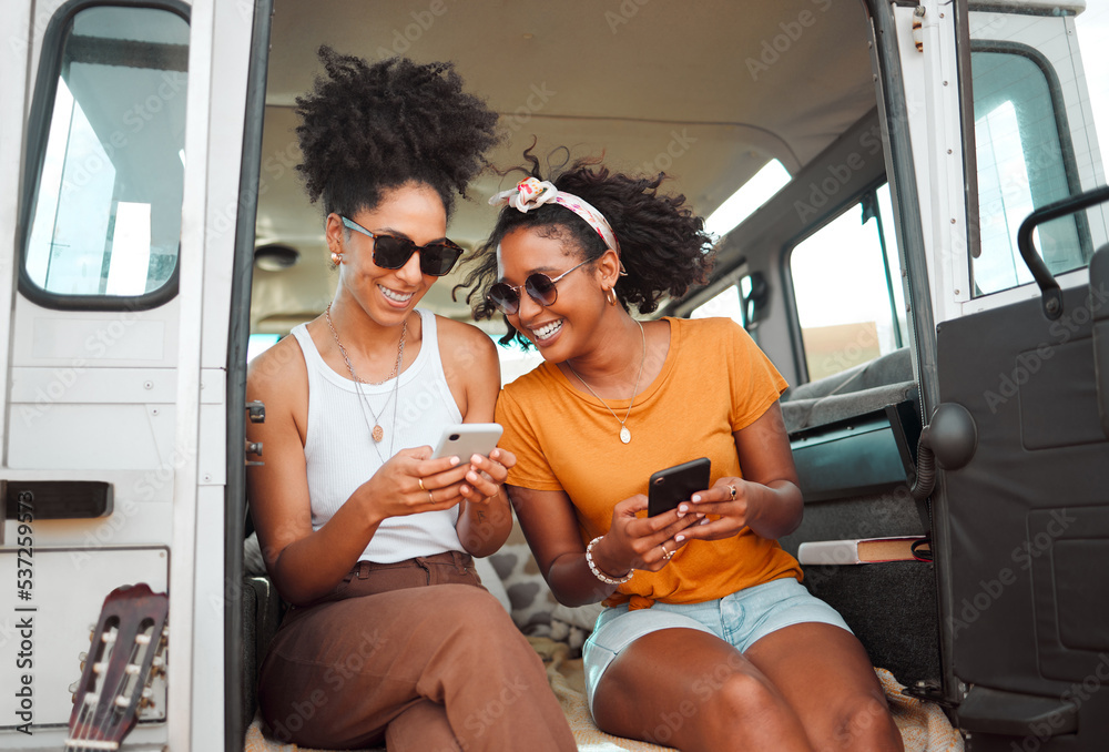 Women, road trip or phone for social media, gps location or map app for safari game drive or summer travel. Smile, happy or bonding friends with 5g mobile technology in camper van in nature landscape - obrazy, fototapety, plakaty 