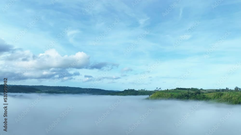 Mountains in fog at beautiful autumn in Phetchabun Thailand. Fog mountain valley, low clouds, forest, colorful sky with. pine trees in spruce foggy forest with bright sunrise Mountains in fog at beautiful autumn in Phetchabun Thailand. Fog mountain valley, low clouds, forest, colorful sky with. pine trees in spruce foggy forest with bright sunrise