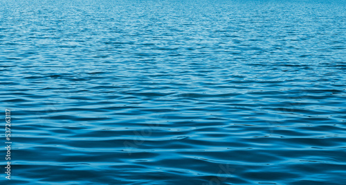 Sea water surface background. Ocean ripple. The calm of nature marine. Blue aqua backdrop.