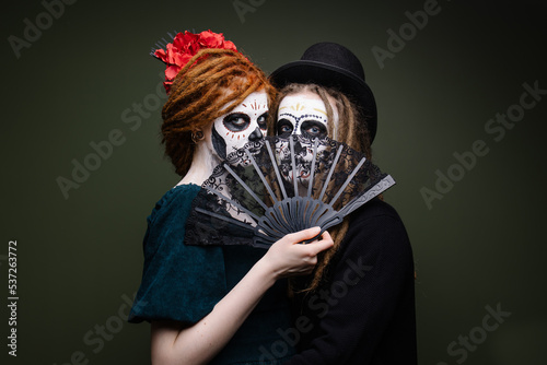 Couple costume for husband and wife mexican day of the dead. Scary skull makeup for halloween. Bride and groom dead zombie masquerade. All Saints' Day is a holiday. Scary faces. Idea for a carnival