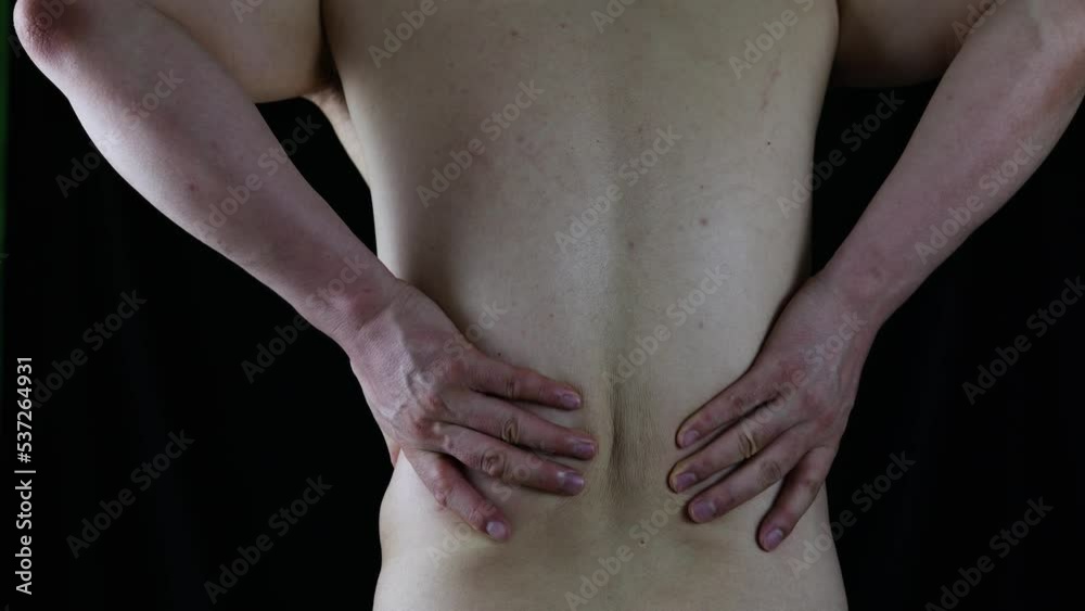 man suffering from back pain man suffering from back pain