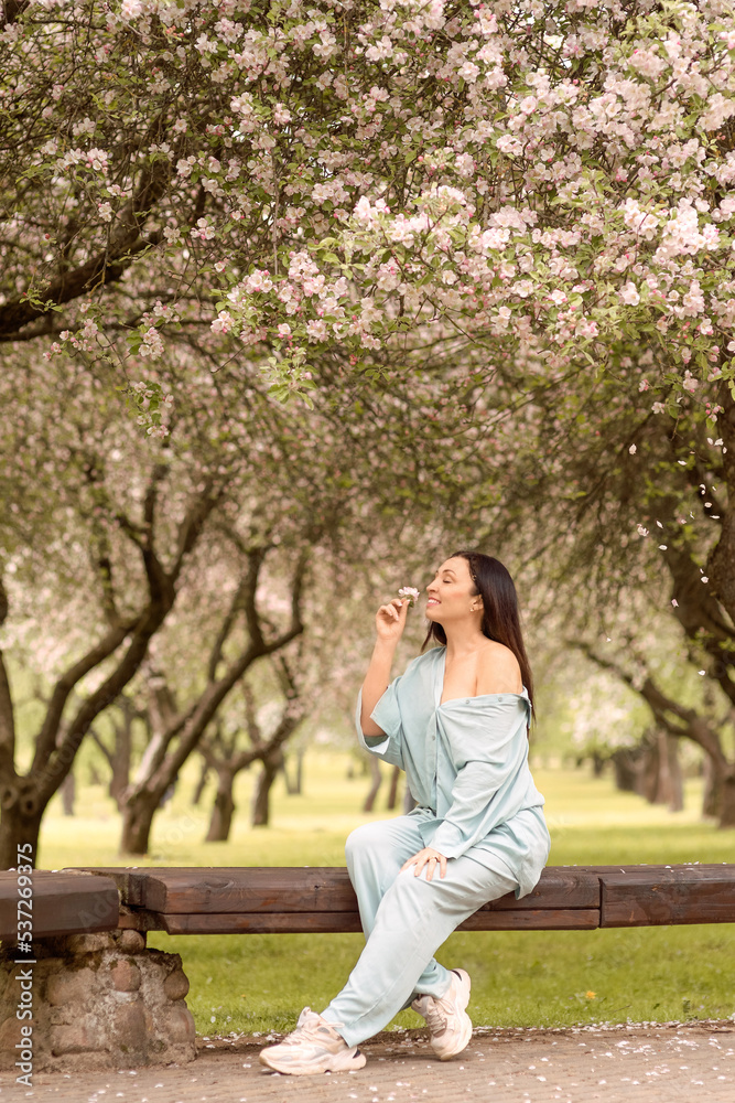 girl with long dark hair in spring blooming garden
girl with long dark hair in spring blooming garden