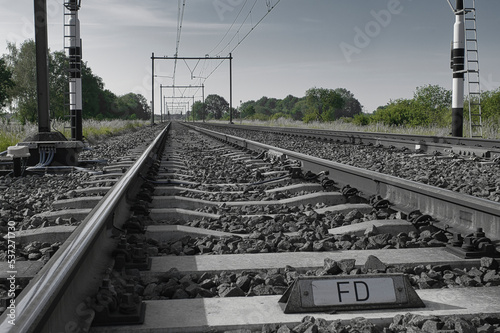 Railroad tracks photo with colored trees made in Weert the Netherlands
