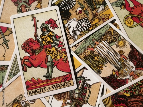 Cork, Ireland - 19 September 2022: Picture of the Knight of Wands tarot card from the original Rider Waite tarot deck with mixed tarot cards in the background
