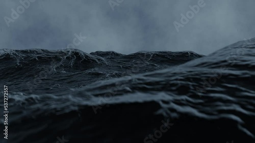 Video simulation of the view from inside a storm in the middle of the sea, with a dark ocean due to the weather and with white foams, with a scene on top of the water and with a dive and with rain