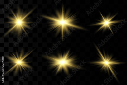 Set of gold bright beautiful stars. Light effect Bright Star. Beautiful light for illustration. Christmas star. White sparks sparkle with a special light. Vector sparkles on transparent background