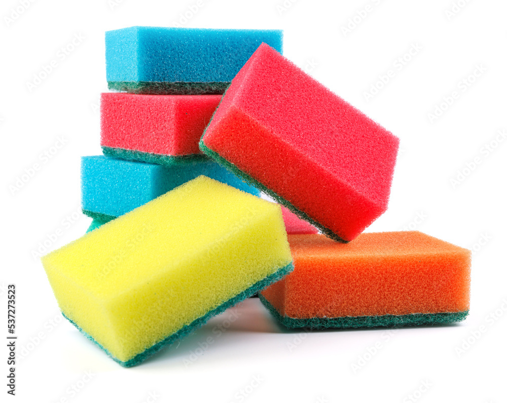 Several multi-colored sponges isolated on a white background. Sponge for washing dishes . Several multi-colored sponges isolated on a white background. Sponge for washing dishes .