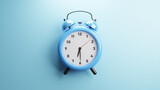 alarm clock on blue background
