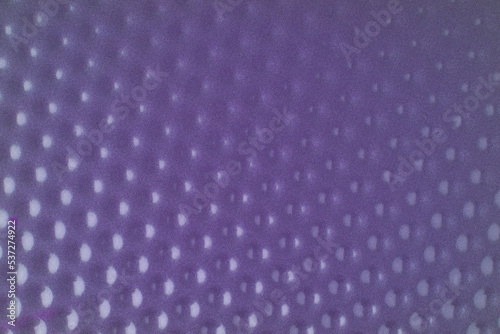 The texture is made of purple metal with many indentations. Closeup
